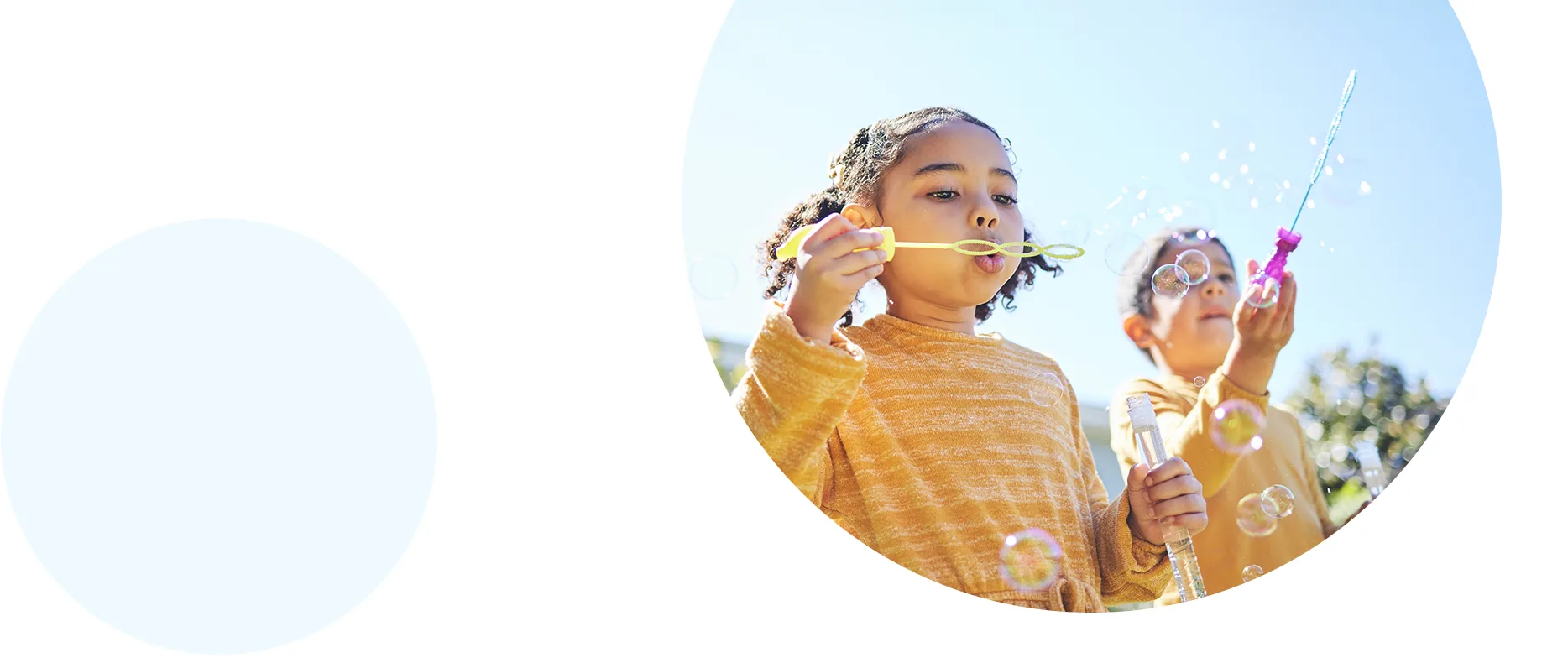 Two children blowing bubbles.